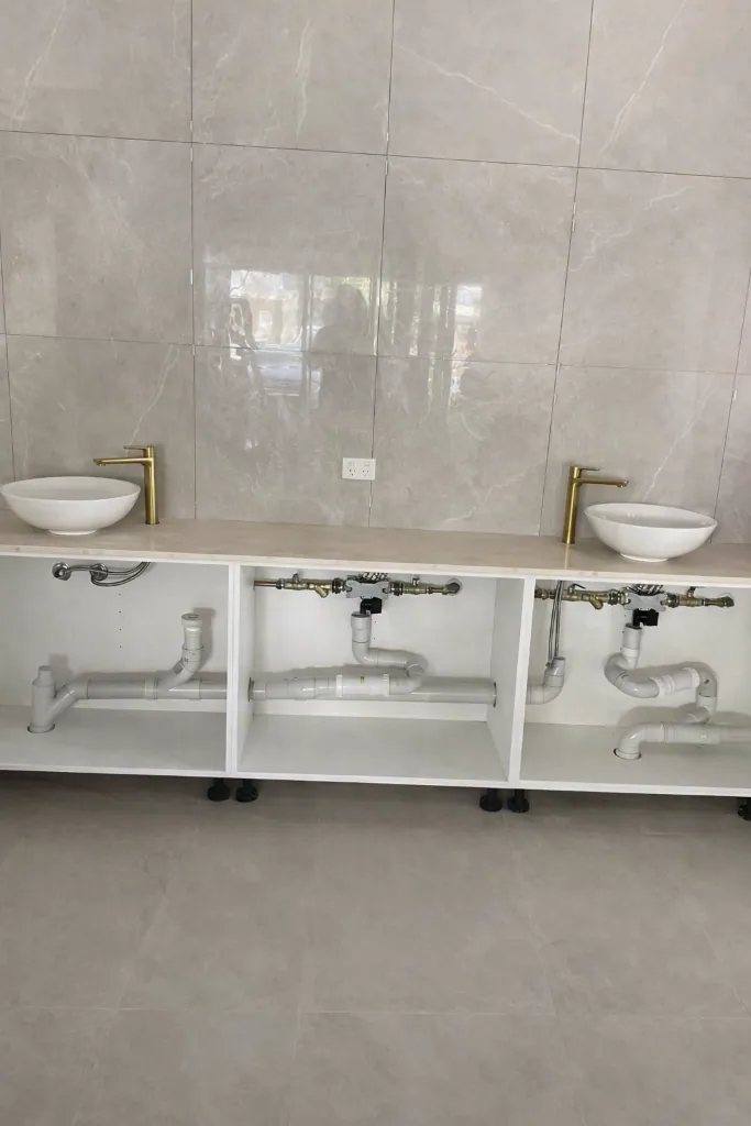 Commercial amenities plumbing during a bathroom refurbishment